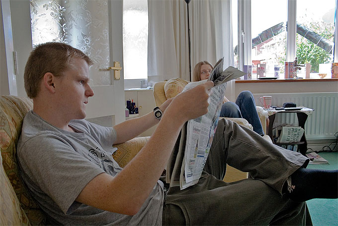 an image of Dan Myatt reading the paper