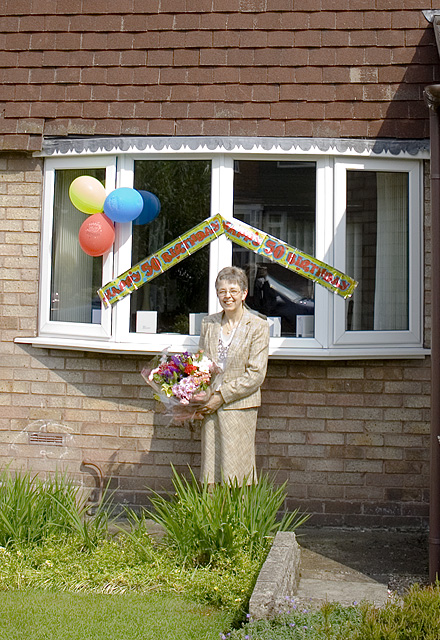 an image of Mum, outside out house
