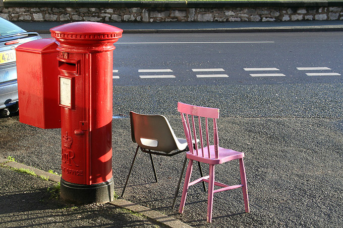 an image of Post office box and a pink chair